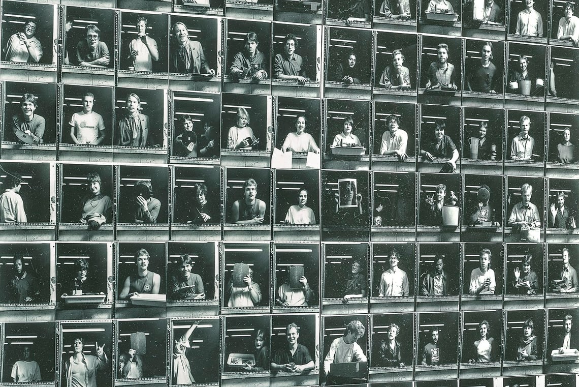 A contact sheet of black and white photos of SMFA students in a grid, peering out of a window