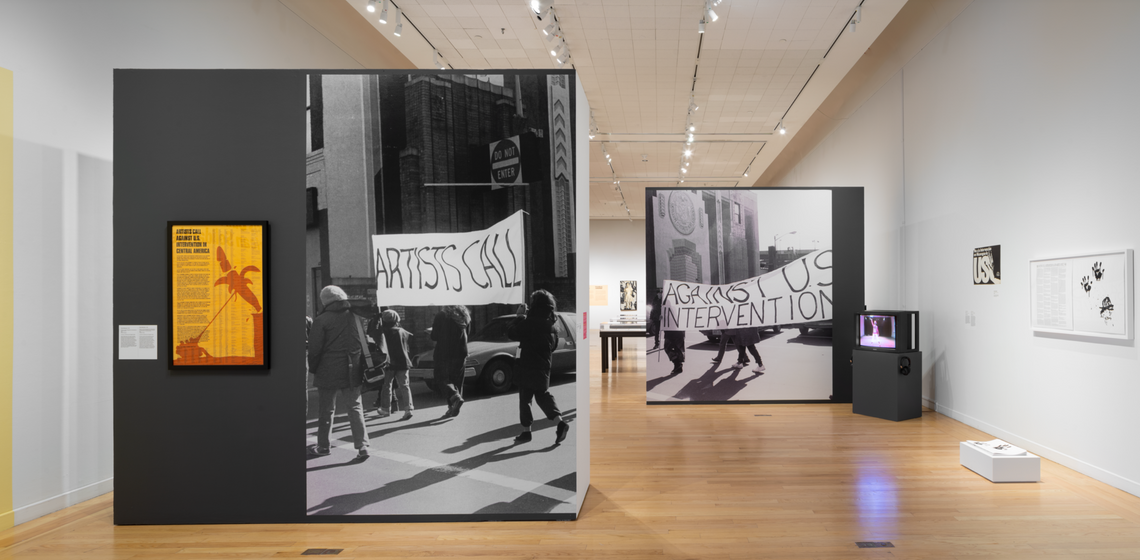 Installation view of Art for the Future exhibition with two walls coveraged with enlarged black and white photos