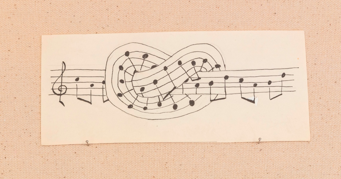Drawing of a knotted musical staff with notes on a brown linen backdrop